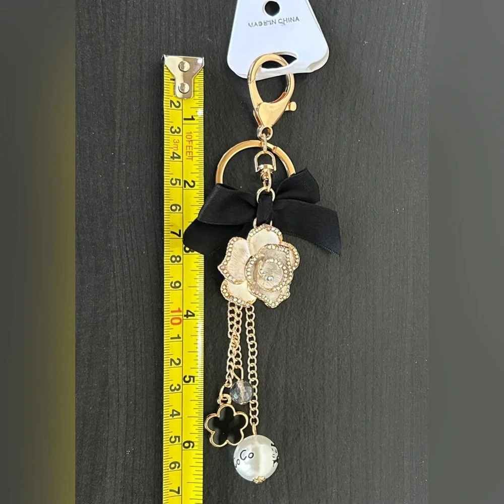 Luxe White Floral Keychain/Bag Charm with Black Bow